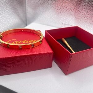 Cartier Gold Multistone Love Bracelet on Red Box